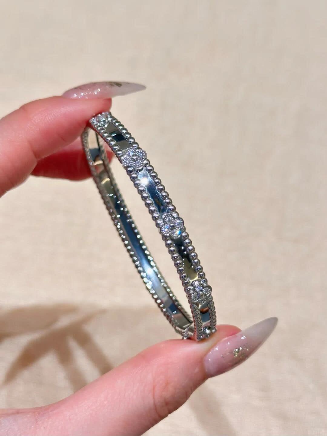 Van Cleef & Arpels Elegant Gold and Silver Bracelets Set